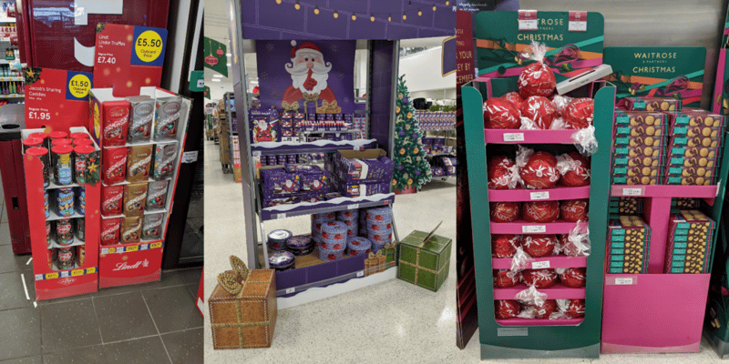 Christmas and holiday-themed endcaps and displays at a U.K. grocery store.