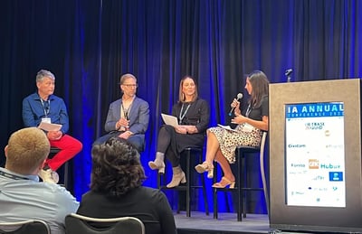 Owen Jenkins, Scott Harmon, Kim Hunter, and Lauren Davitt participating in a panel discussion on sustainability at IA Annual 2002