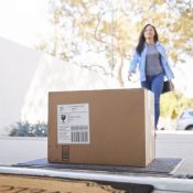 Woman Collecting Home Delivery at the Front Door