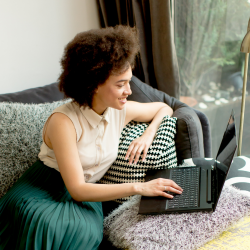 Woman reading Newsletter on Laptop